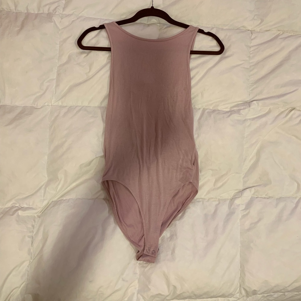 Light pink body suit with open back